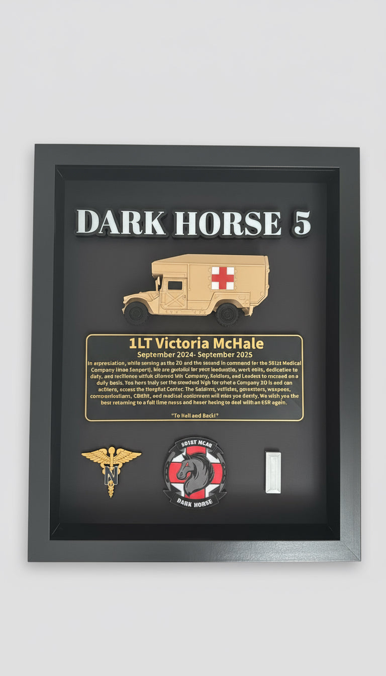 Framed display with 'Dark Horse 5' and medical vehicle illustration, featuring text and logos.