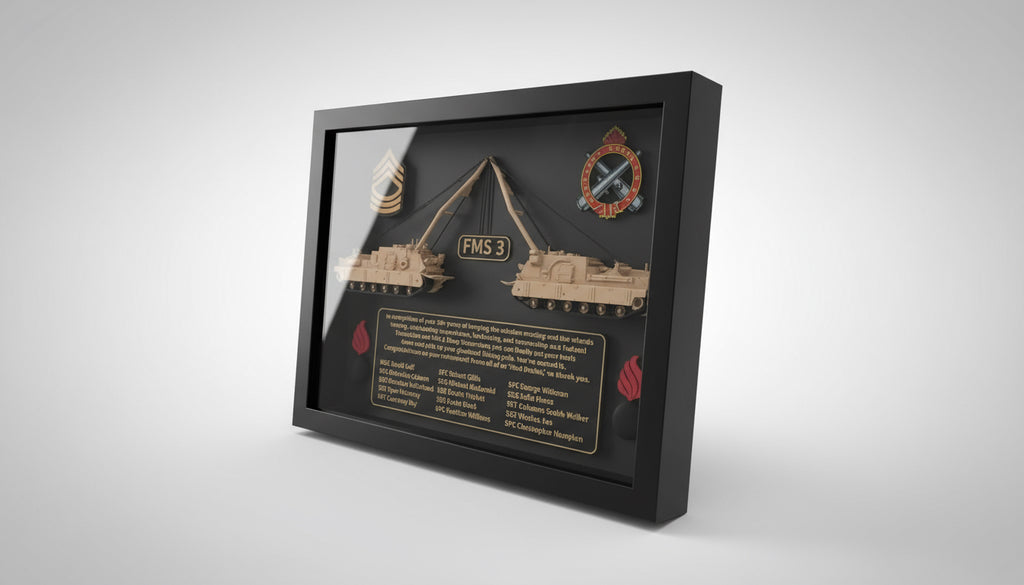Framed military-themed display with tank models and text on a desk.