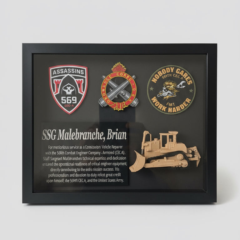 Framed plaque with logos and text, held by a person indoors.