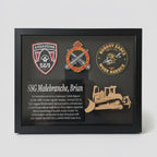 Framed plaque with logos and text, held by a person indoors.