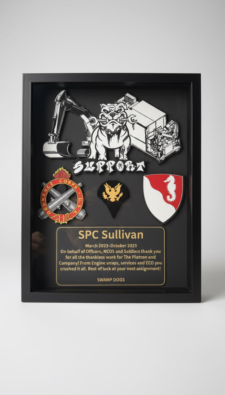 Framed award or recognition plaque held by a hand, featuring graphics and text.